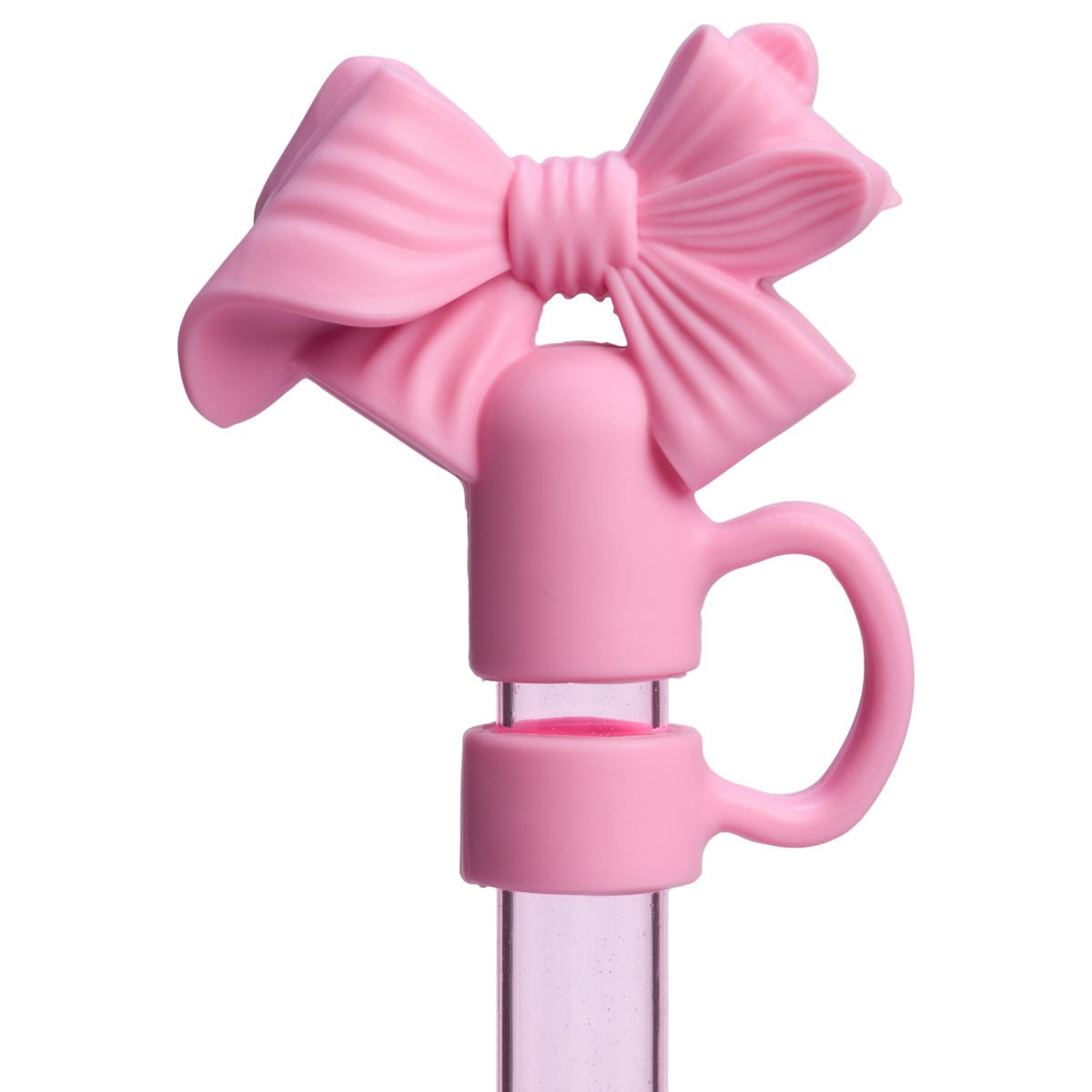 Pink silicone straw topper with a large textured bow design on clear straw