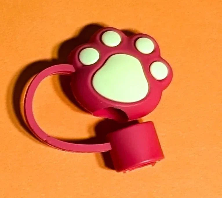 Red and white cat paw-shaped hand sanitizer holder on orange background