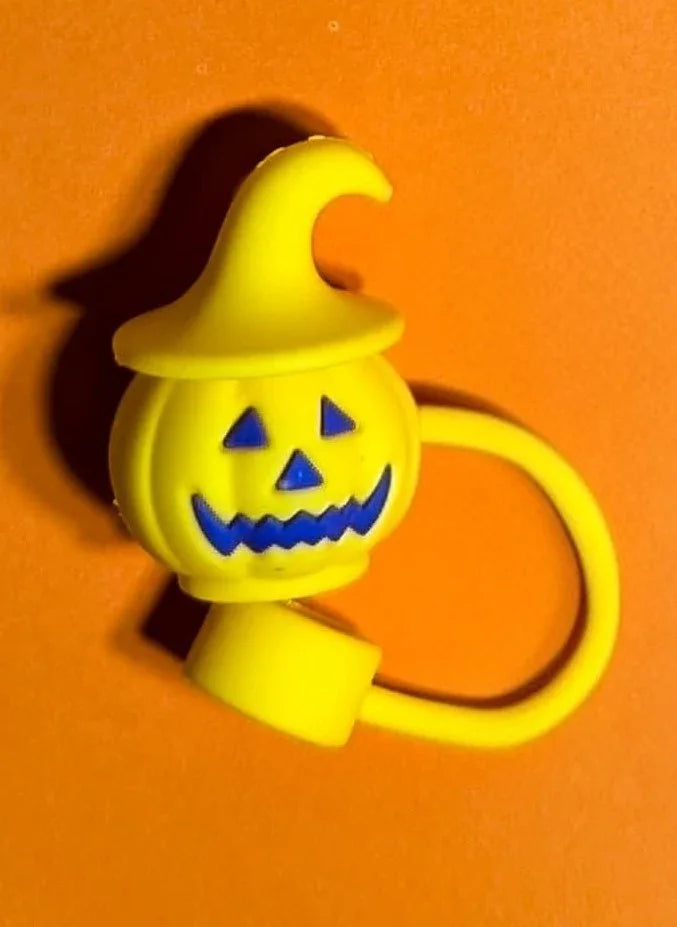 Yellow Halloween pumpkin silicone ring with witch hat on orange background