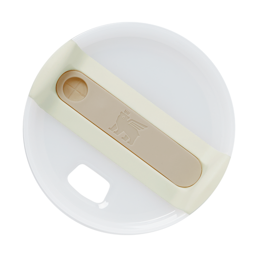 white circular coffee cup lid with beige silicone grip band featuring embossed lion logo