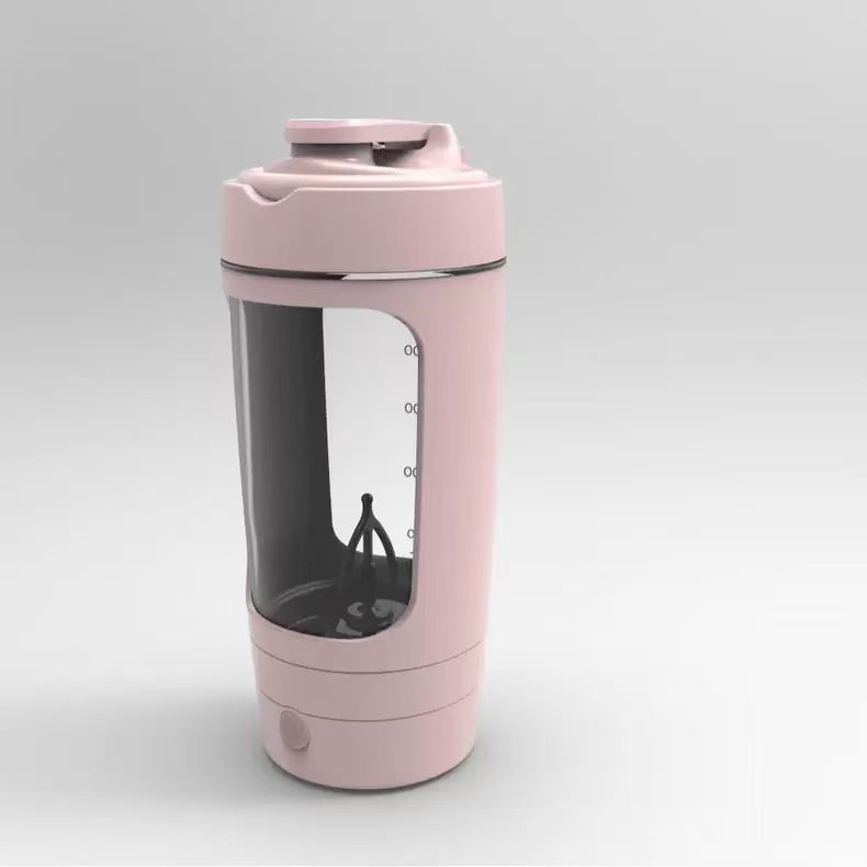 Pink portable electric protein shaker bottle with transparent window and mixing blade