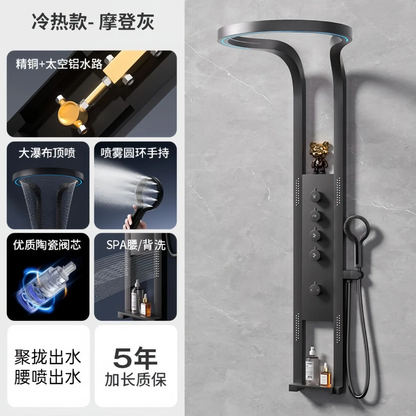 Modern gray shower panel with overhead rain shower, hand spray, control knobs, and integrated shelf