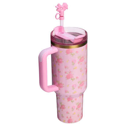 Pink floral insulated travel mug with handle, straw, and fan on lid