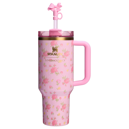 Pink Stanley LoveShackFancy floral travel tumbler with handle and decorative bow straw