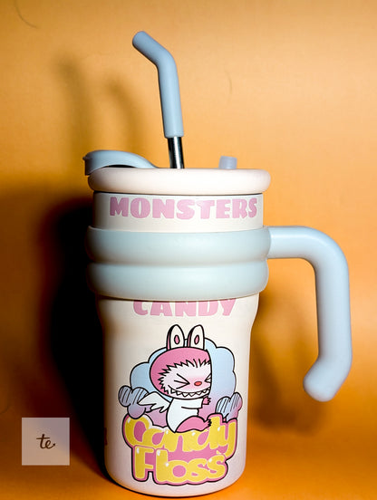 Cute Monsters Candy Floss sippy cup with blue handle and silicone straw on orange background