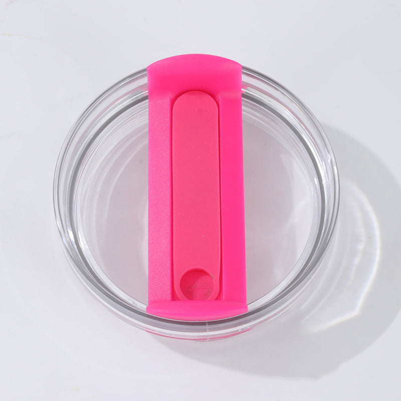 Round clear glass ashtray with a bright pink silicone cigarette holder on white background
