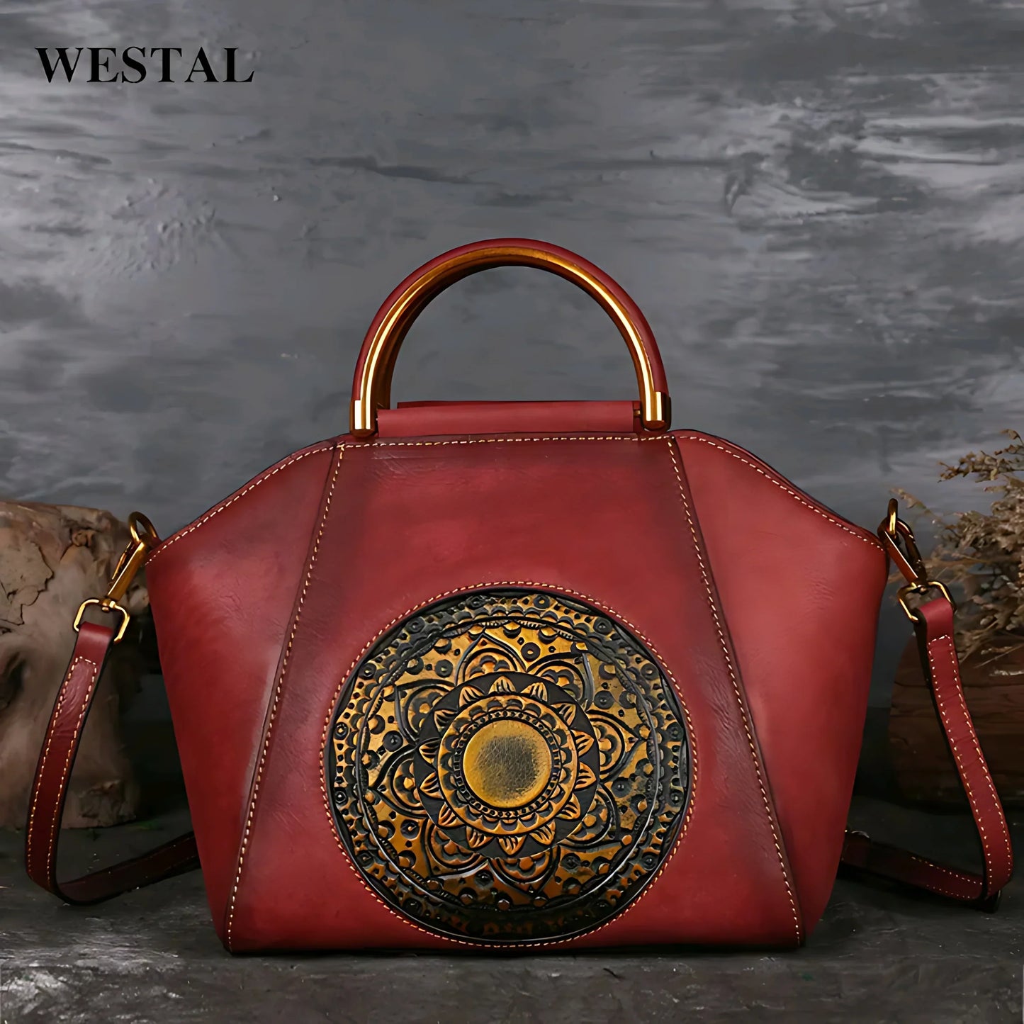 Red leather handbag with embossed floral mandala design and gold metal handle by Westal