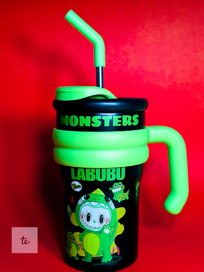 Black and green Monsters Labubu sippy cup with green handle and straw on red background